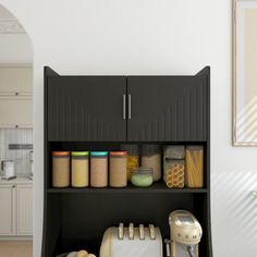 a kitchen area with an oven, blender and cabinets