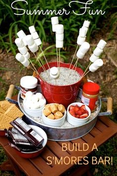 a bucket filled with marshmallows and other snacks