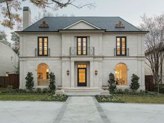 a large white house with lots of windows