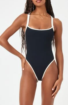 Contrast trim lends sporty appeal to this open-back one-piece swimsuit with allover ribbed texturing. Elasticized straps Cheeky back coverage 97% nylon, 3% spandex Spot clean Imported Conservative Two Piece Bathing Suits, Bathing Suits For Vacation, Teen Swimwear One Piece, Aerie Swimsuits Bikinis, Classy Swimwear Bikinis, Bali Baecation, Trendy One Piece Swimsuit, Cute One Piece Bathing Suits Modest, Cute 1 Piece Swimming Suits