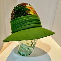 1960's Posh Green Vintage Hat Trimmed In Colorful Pheasant Feathers - Osstylish & Elegant High Fashion Green Hat Designed By Lecie & Union Made Out Of A Knit Fabric That Features Top Stitching On The 3" Brim & A Tucked Hatband . Crown Is Covered With Colorful Peacock Feathers. One Size Fits Most. The Hat Is A Bit Pliable So You Can Pull It Down Or Tilt It Up To Your Liking. There Is Green Netting On Top Of The Feathers To Hold Them Down Against The Brim. Excellent Condition, Looks Like It Was Barely Worn If At At All! Very Clean & Very Cute, Perfect For Spring, Would Work Well For Saint Patrick's Day, Easter, Church, And General Dressing Up. Charming & Pretty! Luxury Green Hat With Curved Brim, Luxury Handmade Green Hats, Novelty Green Hats With Curved Brim, Vintage Green Wide Brim Hat, Elegant High Fashion, Vintage Green Adjustable Hat, Colorful Peacock, Green Hat, Pheasant Feathers