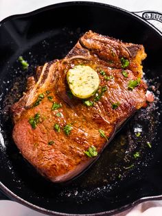 a piece of meat in a skillet on a table