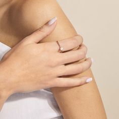 a woman's arm with a ring on it