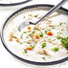 a bowl of soup with chicken and carrots