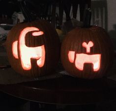 two pumpkins carved to look like elephants