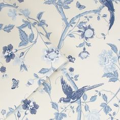 a blue and white wallpaper with flowers and birds on it's side,