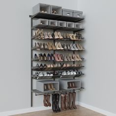 a shoe rack with several pairs of shoes on it and two bins for each pair