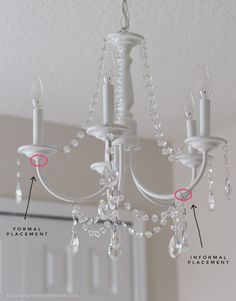 a white chandelier hanging from the ceiling with instructions on how to fix it