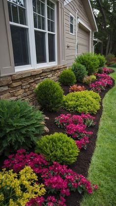 the front yard is full of colorful flowers