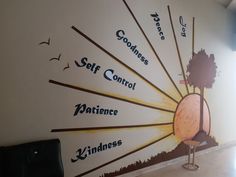 a wall with the words self control on it and an image of a sunburst