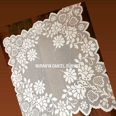 a white doily with the words, nurn danielle on it's side