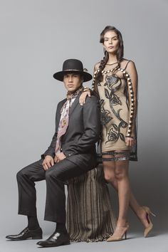 a man and woman posing for a fashion photo