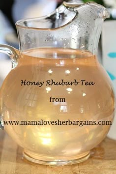 a pitcher of honey rhubart tea sits on a table with the words honey rhubart tea from