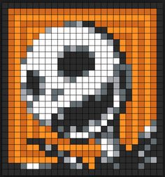 an orange and black pixellated pattern with a skull on it