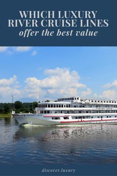 a large white boat floating on top of a river