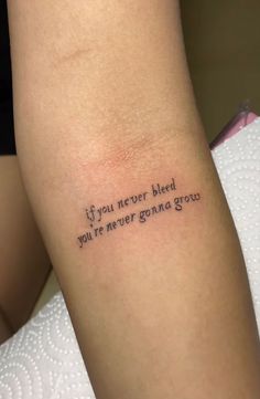 a woman's arm with a tattoo saying if you never bleed, you're never