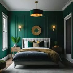 a bedroom with green walls and gold accents