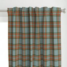 a window curtain with a plaid pattern on it