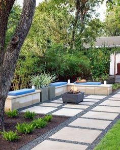 an outdoor patio area with plants and trees