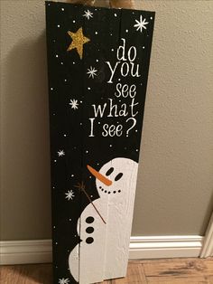 a wooden sign that says do you see what i see? with a snowman on it