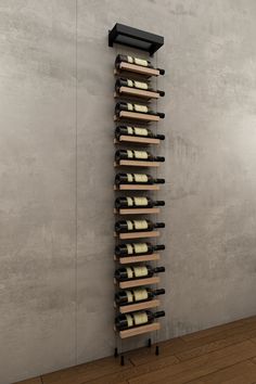 a wine rack with many bottles in it on the wall next to a wooden floor