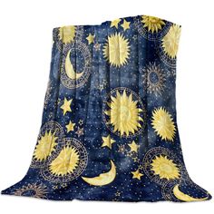 the sun and moon print blanket is on display in front of a white background with stars