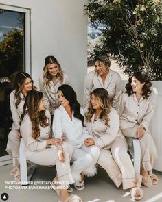 the bridesmaids are all dressed in white