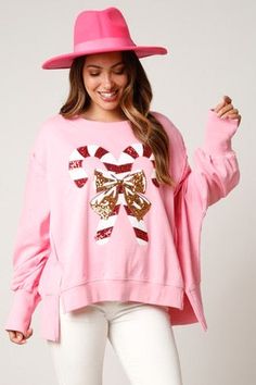 Tis the season! An adorable bubble gum oversized pink sweatshirt featuring wide ribbed cuffs, high low hem with side slits and open waistband. Adorned in red, white and gold sequins featuring candy cane and bow patches. Sequined Sweatshirt, Bubble Gum Pink, Dropped Shoulder Sweatshirt, Winter Mode, Holiday Sweatshirt, Christmas Hoodies, Christmas Fabric, Candy Canes, Pink Sweatshirt