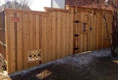 a wooden fence with two doors on each side