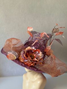 Liana climbs high in beautiful lilac purple and pink metallics. Woven design set on a straw base with beautifully sculpted floral accents makes this hat an over the top stand out piece. Kentucky derby church hat is perfect for any special occasion or event. Inside features elastic headband to allow for a comfortable and adjust able fit. Floral arrangement can be worn to the side or front and center. All designs are made by hand with no two identical. Custom requests are accepted!  This custom straw hat sculpted and designed by milliner, Alyssa Clarenson.  Hat is 18Length x 18 Width x 10" height. * Please note, due to special nature of product and health and safety concerns, returns are not accepted. All items shipped with tracking and insurance, if there is ever an issue, please contact me Purple Adjustable Hat For Kentucky Derby, Adjustable Purple Hat For Kentucky Derby, Purple Hat With Short Brim For Royal Ascot, Lavender Adjustable Hat For Kentucky Derby, Purple Short Brim Hat For Royal Ascot, Adjustable Lavender Hat For Kentucky Derby, Purple Wide Brim Hat For Races, Purple Mini Hat With Curved Brim For Kentucky Derby, Purple Curved Brim Mini Hat For Kentucky Derby