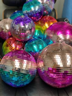 several shiny disco balls sitting on top of a table