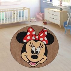 a mickey mouse rug in a child's room