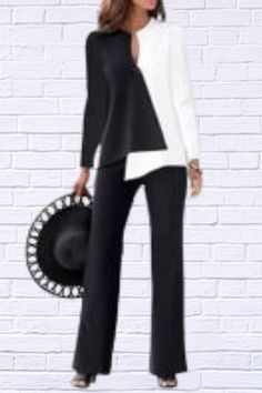 Elevate your style with our sophisticated Black and White Color Blocking Long Sleeve Top and Long Pants Two-piece Set. This chic ensemble is designed to offer both comfort and elegance, making it a perfect addition to your wardrobe for any occasion. Key Features: Color Blocking Design: The striking black and white color blocking creates a bold and modern look that’s sure to turn heads. Two-piece Set: Includes a long sleeve top and matching long pants for a coordinated and polished outfit. Fabric Softness: Enjoy moderate softness for a comfortable fit throughout the day. Non-Stretch Fabric: Designed with non-stretch fabric to provide a structured and tailored look. Fabric Thickness: Thin fabric ensures breathability and comfort, making it ideal for year-round wear. Fit Type: Standard fit of Elegant Stretch Two-piece Set, Chic Two-piece Set, Chic Long Sleeve Two-piece Pantsuit, Chic Two-piece Long Sleeve Pantsuit, Chic Two-piece Long Sleeve Pant Set, Chic Two-piece Pants Set For Work, Chic Two-piece Set Bottoms For Workwear, Chic Business Casual Sets For Fall, Elegant Two-piece Pants Set