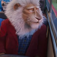 a lion mask sitting in the passenger seat of a car next to a person wearing a red jacket