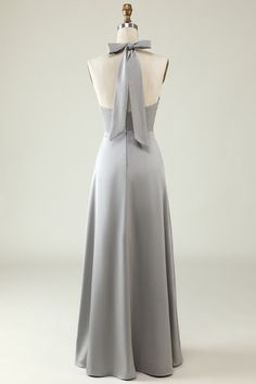 the back of a dress with a bow at the neck, on a mannequin