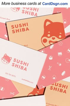 some business cards are stacked on top of each other with the words sushi shiba printed on them