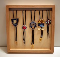 a shadow box with several badges in it