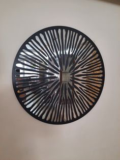 a circular mirror hanging on the wall