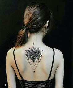 a woman with a tattoo on her back