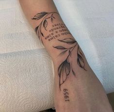 a woman's foot with a quote tattooed on it