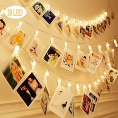 a string of lights with pictures hanging from it