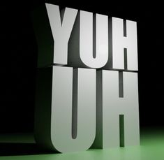 the word huy huy is projected on a green surface in front of a black background