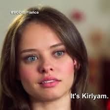 a woman with blue eyes is looking at the camera and has a caption that reads, it's kiryam