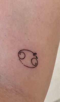 a small tattoo on the leg of a woman