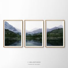 three framed photos hanging on the wall above a lake with mountains in the background and text that reads, hellolostudio