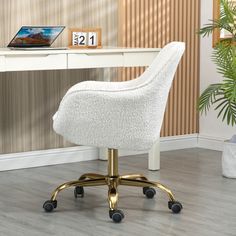 a white desk chair sitting on top of a wooden floor