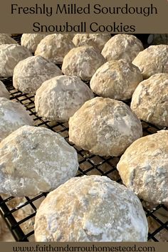 freshly baked sourdough snowball cookies cooling on a rack with text overlay