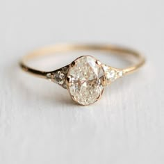 an engagement ring with three diamonds on it