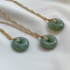 Elegant Jade Necklace - Natural Green Gemstone Pendant Elevate your style with this exquisite jade necklace featuring a natural Myanmar jade gemstone. Known for its soothing energy and timeless beauty, the jade pendant is hand-polished to perfection and carefully set in a high-quality, tarnish-resistant chain. Whether worn alone or layered with other pieces, this necklace adds a touch of elegance and serenity to any outfit. Perfect for everyday wear or special occasions, it also makes a meaningful gift for loved ones. Material: Natural Myanmar Jade, Gold filled twist chain Necklace length: 16"+2" If you have specific details like chain type or length, I can refine it further! Jade Pendant Necklace, Jade Gemstone Necklace Gift, Gold Jade Necklace With Round Pendant, Gold Jade Round Pendant Necklace, Hand-strung Round Jade Necklace, Hand-strung Round Jade Necklaces, Jade Necklace Pendant, Green Stone Necklace, Jade Necklace