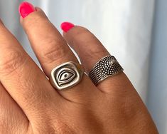 Part of our women's ring collection, the Evil Eye ring and the Dotted Chevalier ring are the perfect addition to your new season wardrobe.  The Dotted Chevalier ring features dots detailing. It's cast from polished silver-plated pewter and hollowed out for a lightweight feel.  With an open eye engraved, the Evil Eye ring is famous for its protective powers. Slightly adjustable rings are also, available in 24k gold plated. These rings are perfect to wear all day with all your outfits.  Please sel Symbolic Open Midi Rings, Symbolic Adjustable Stackable Open Rings, Adjustable Symbolic Metal Rings, Silver Statement Rings, Symbolic Handmade Metal Rings, Chunky Gold Rings, Eye Ring Silver, Open Ring Gold, Gold Pinky Ring